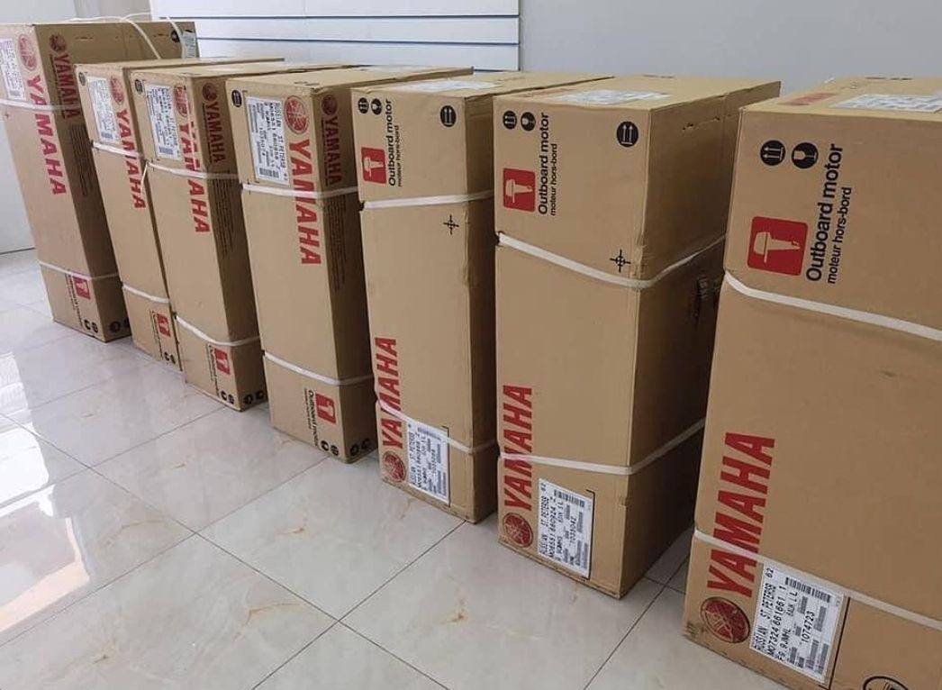 New Yamaha outboard motors in factory boxes at the Apex Marine showroom