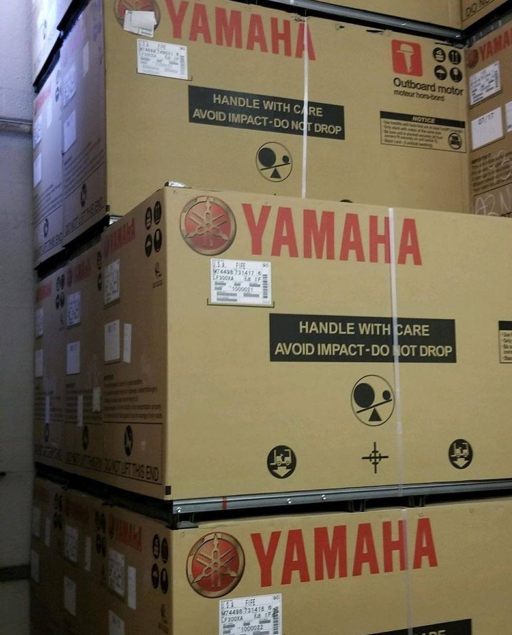Stacked Yamaha outboard motor boxes including 300HP models