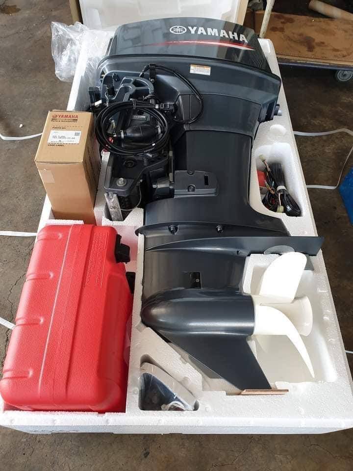 Yamaha 85 outboard motor uncrated with fuel tank, propeller and accessories